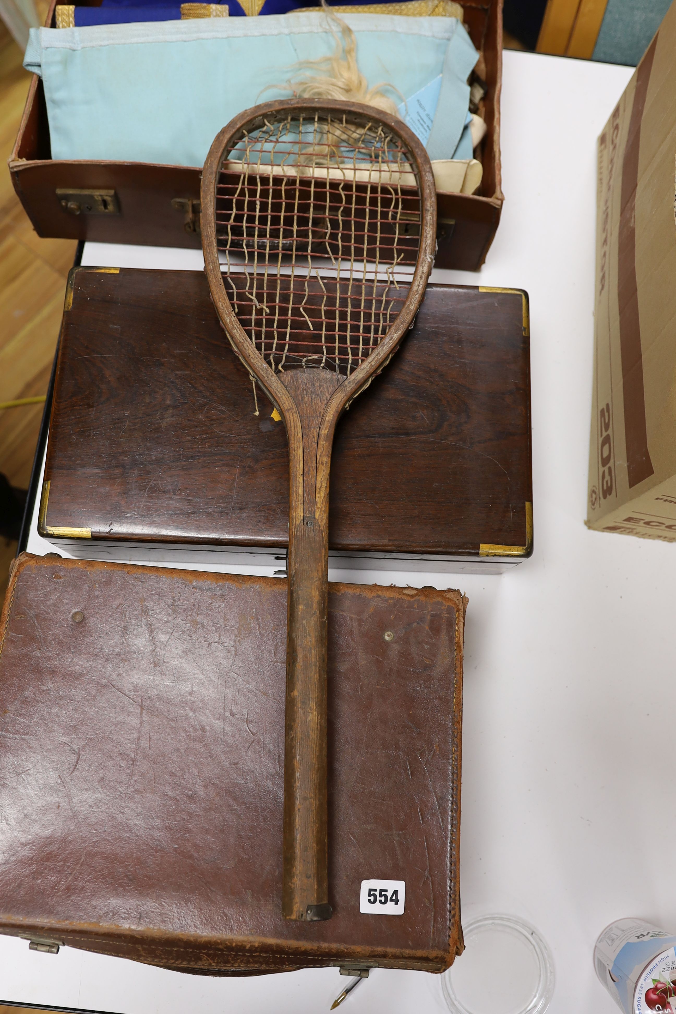 A brass bound writing slope, two small cases of Masonic Regalia and an antique tennis racquet